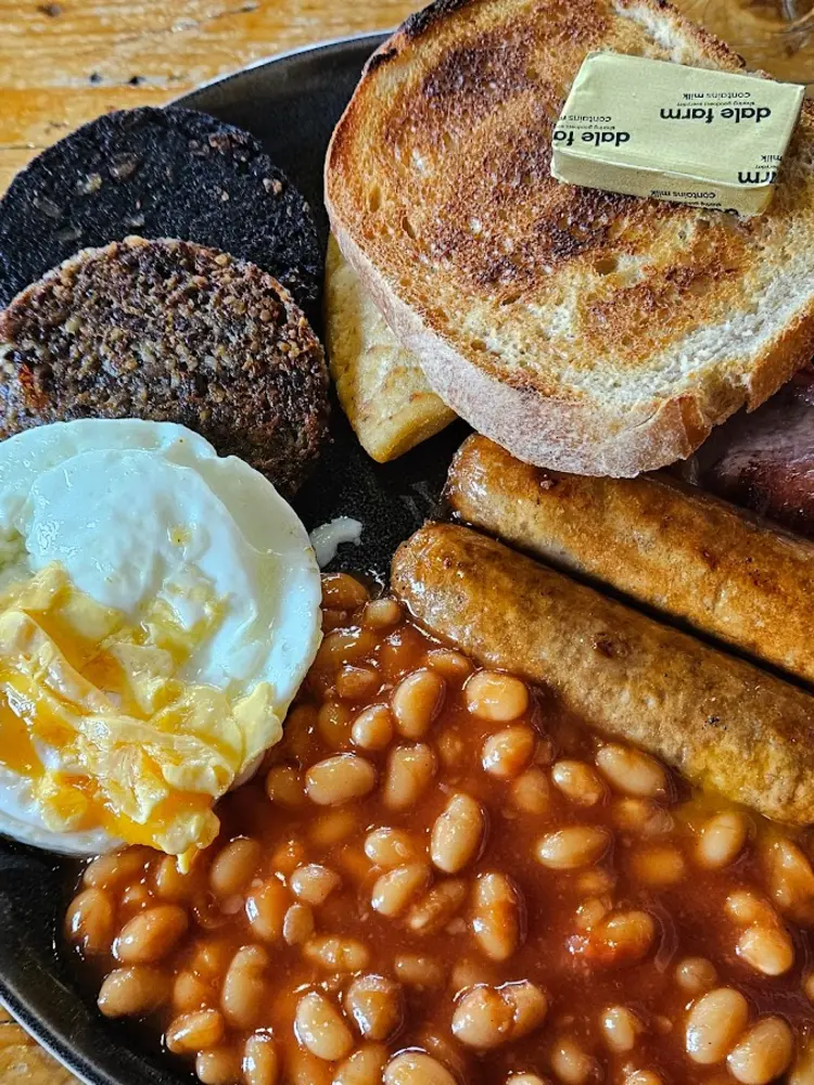 Full Scottish breakfast plate with black pudding, haggis, sausages and beans