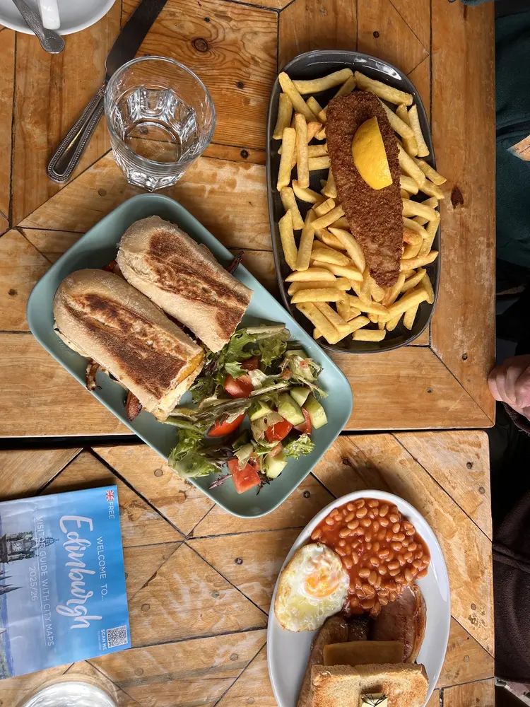 Fish and chips with lemon and a toasted baguette with side salad